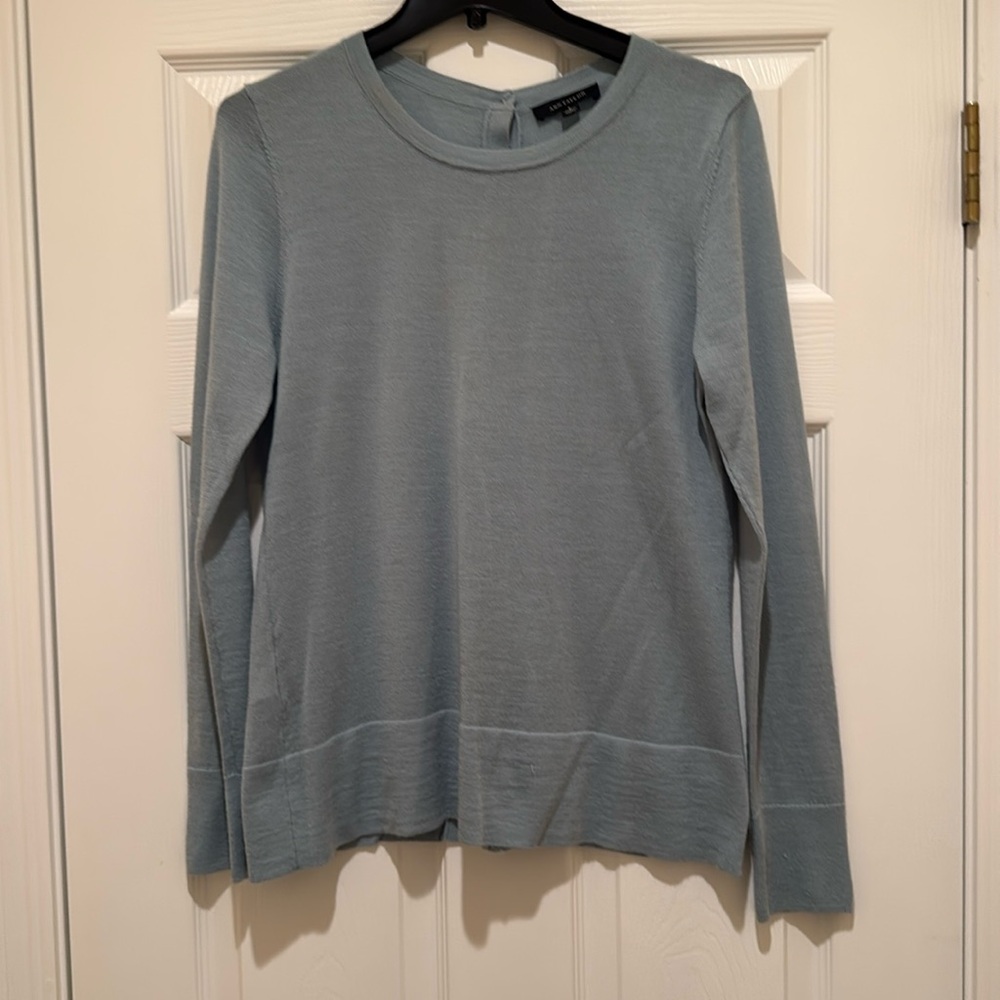 Light blue crew neck thin sweater.